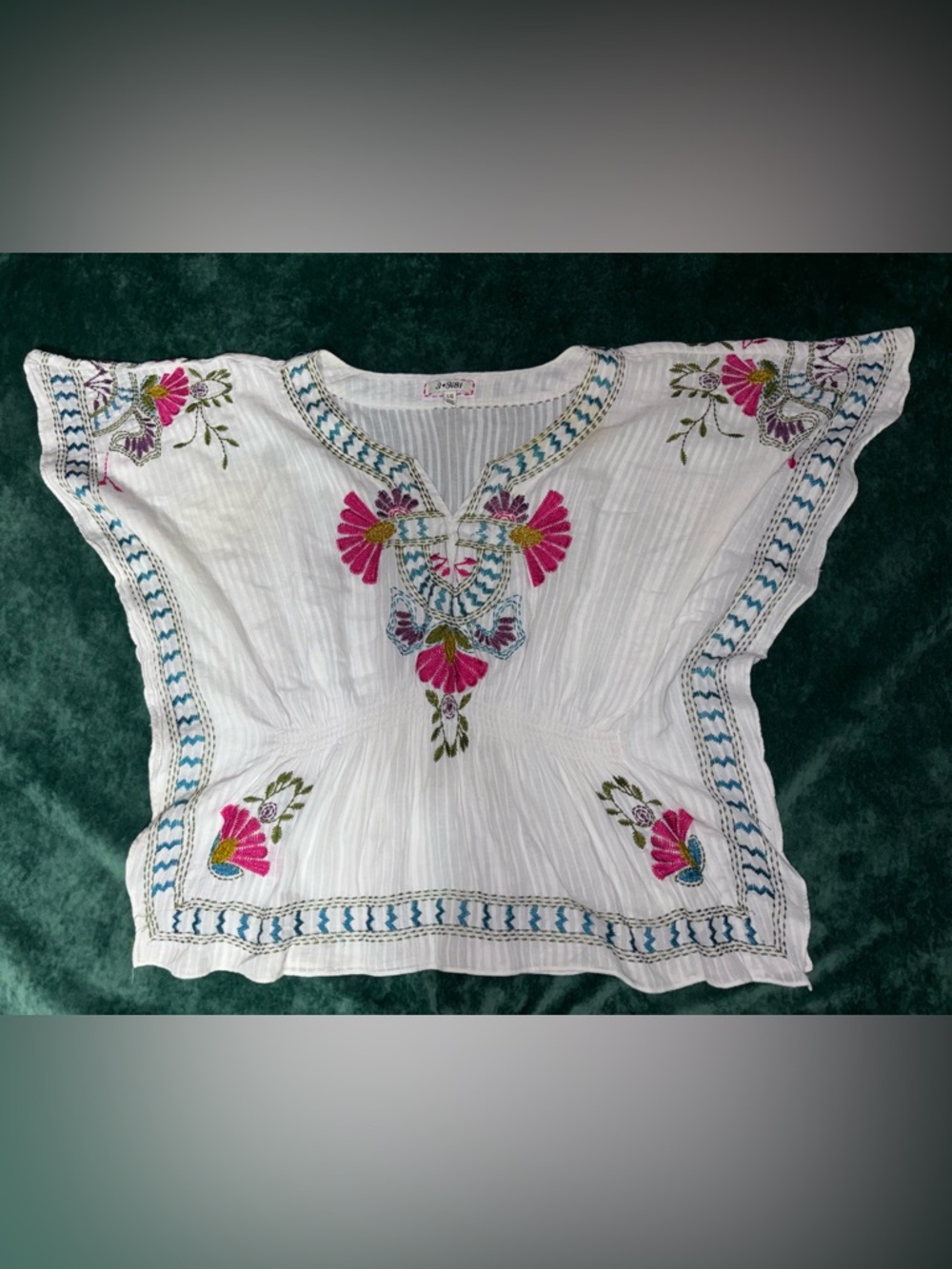 Johnny was White Embroidered Tunic Top with Pink Floral Accents